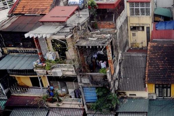 Hanoi’s old streets with iron roofs and cages