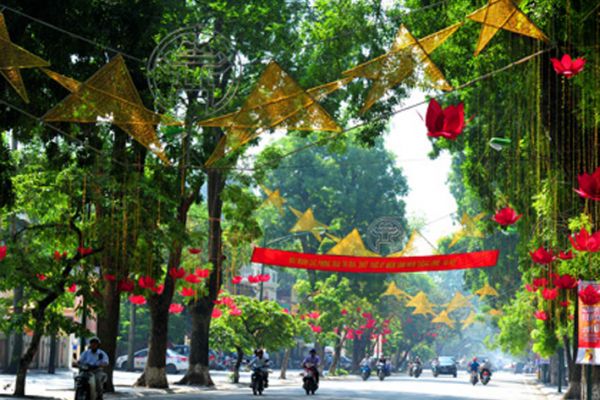 Streets of Hanoi crowded with people and national flags on National Day